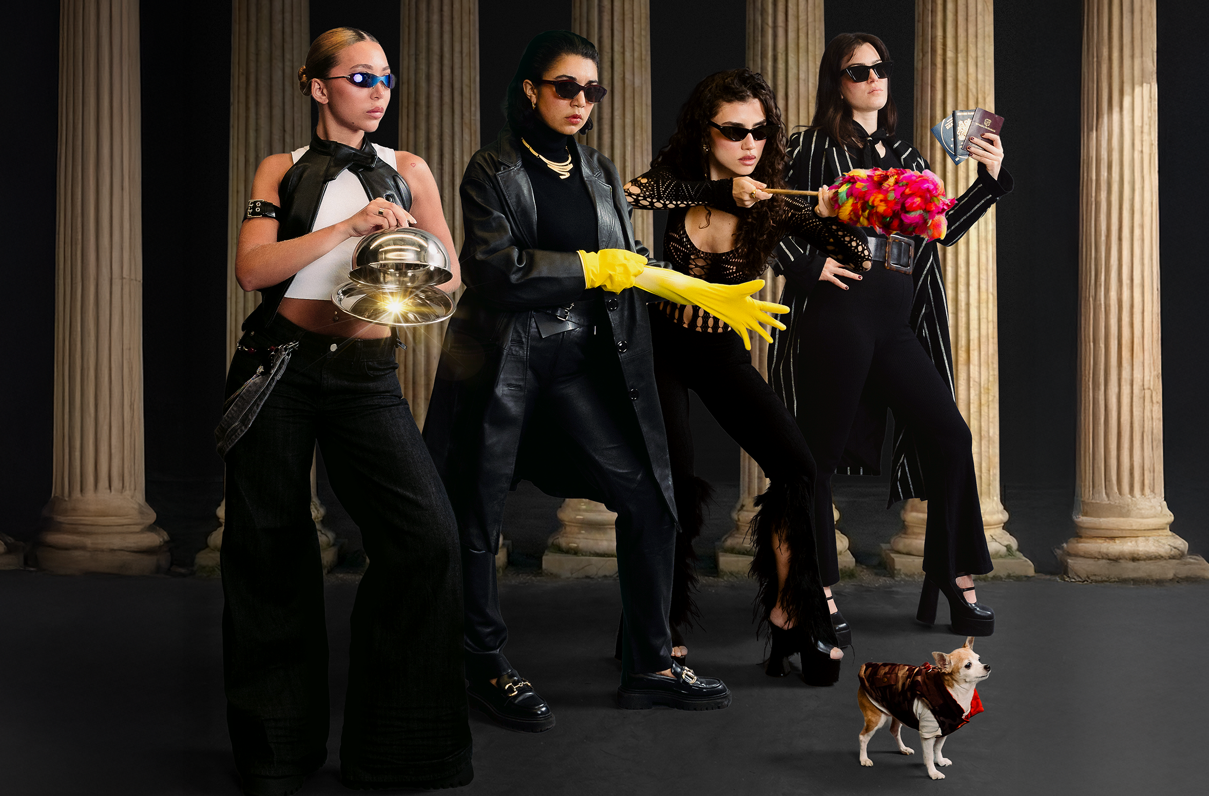 Four Latinx women pose in sunglasses looking mysterious holding a sparkly cloche, a yellow rubber glove, a red feather duster and a handful of passports. A chihuahua stands in a coat in front of them. 