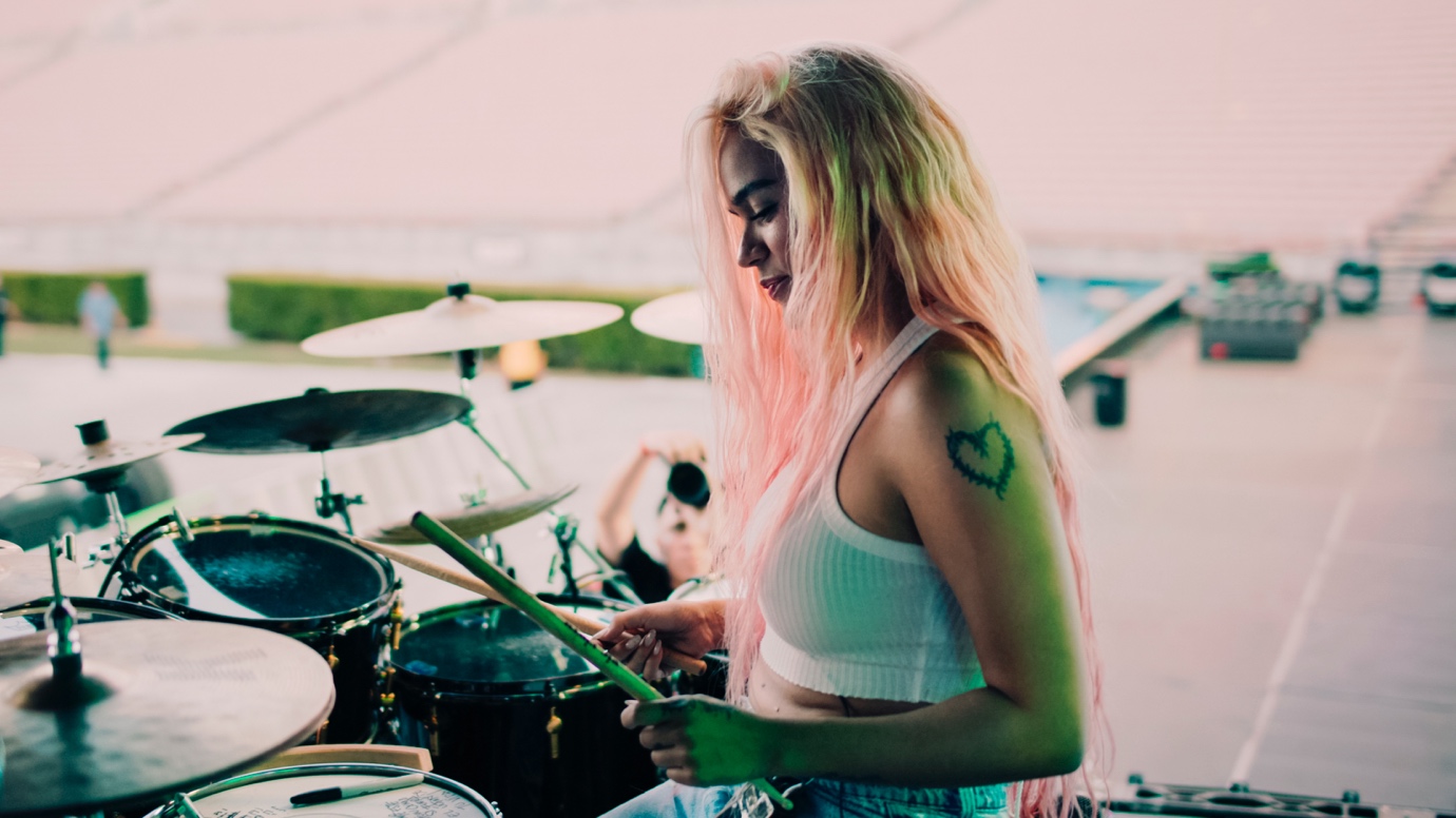 A person playing drums

AI-generated content may be incorrect.