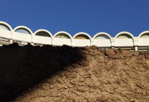 The organic soil texture of origo against the geometrical modern architecture of the Barbican.